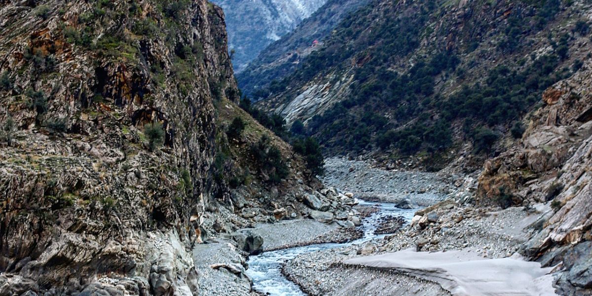 Clear mountain stream flowing over rocks in northern Pakistan